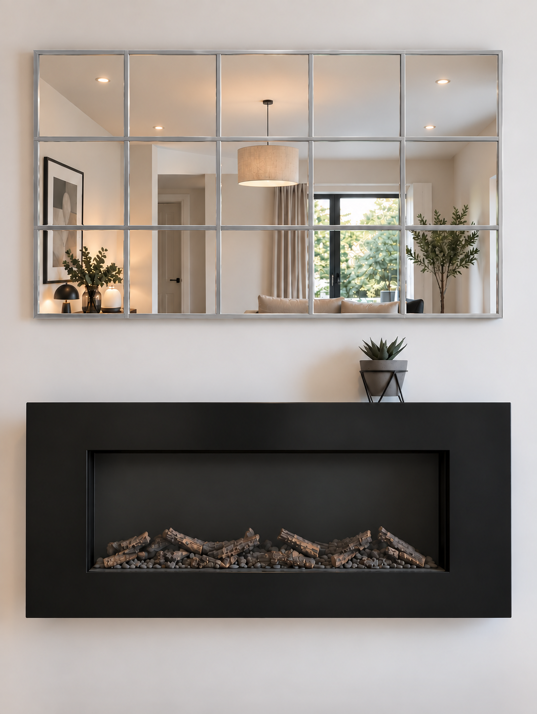 A modern rectangular mirror with a silver metal frame