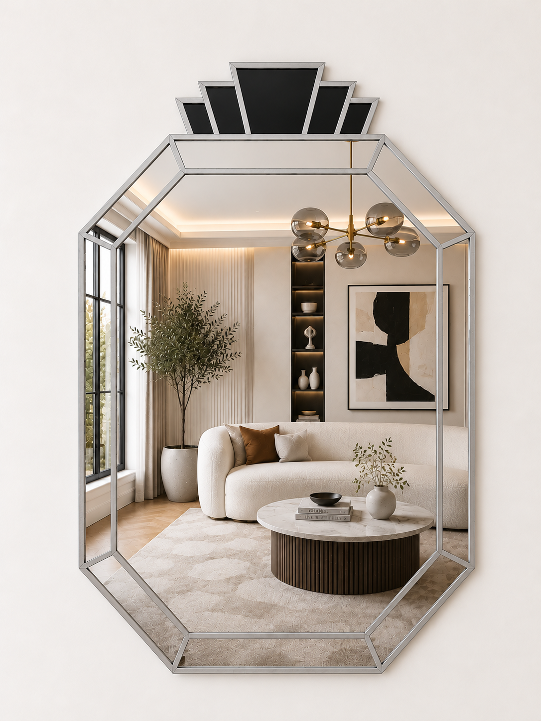 An octagonal wall mirror with a silver metal frame and a black geometric crown, reflecting a modern living room interior with a cream sofa, marble coffee table, and warm ambient lighting.