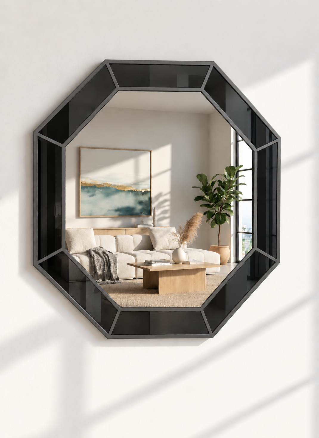 An octagonal wall mirror with a glossy black frame, mounted on a white wall. The mirror reflects a modern living room interior with a beige sofa, wooden coffee table, and a potted green plant.