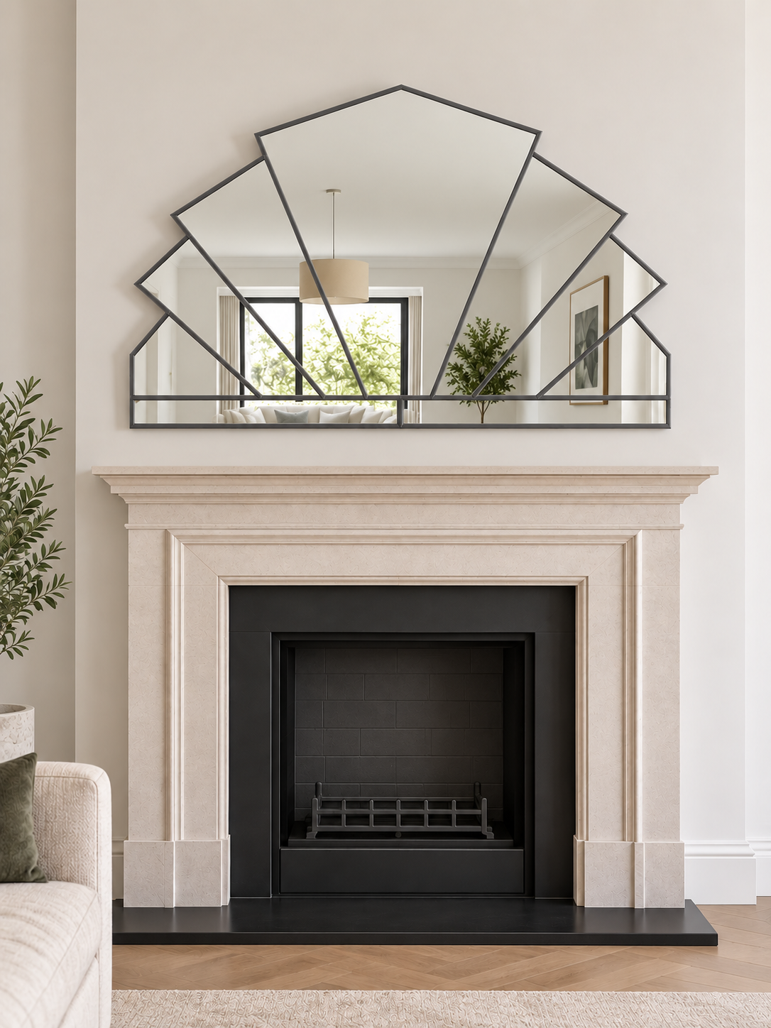 A large geometric overmantle mirror in antique