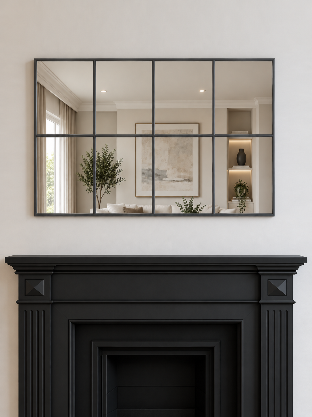 A large rectangular wall mirror with an antique metal grid frame hangs above a black fireplace 