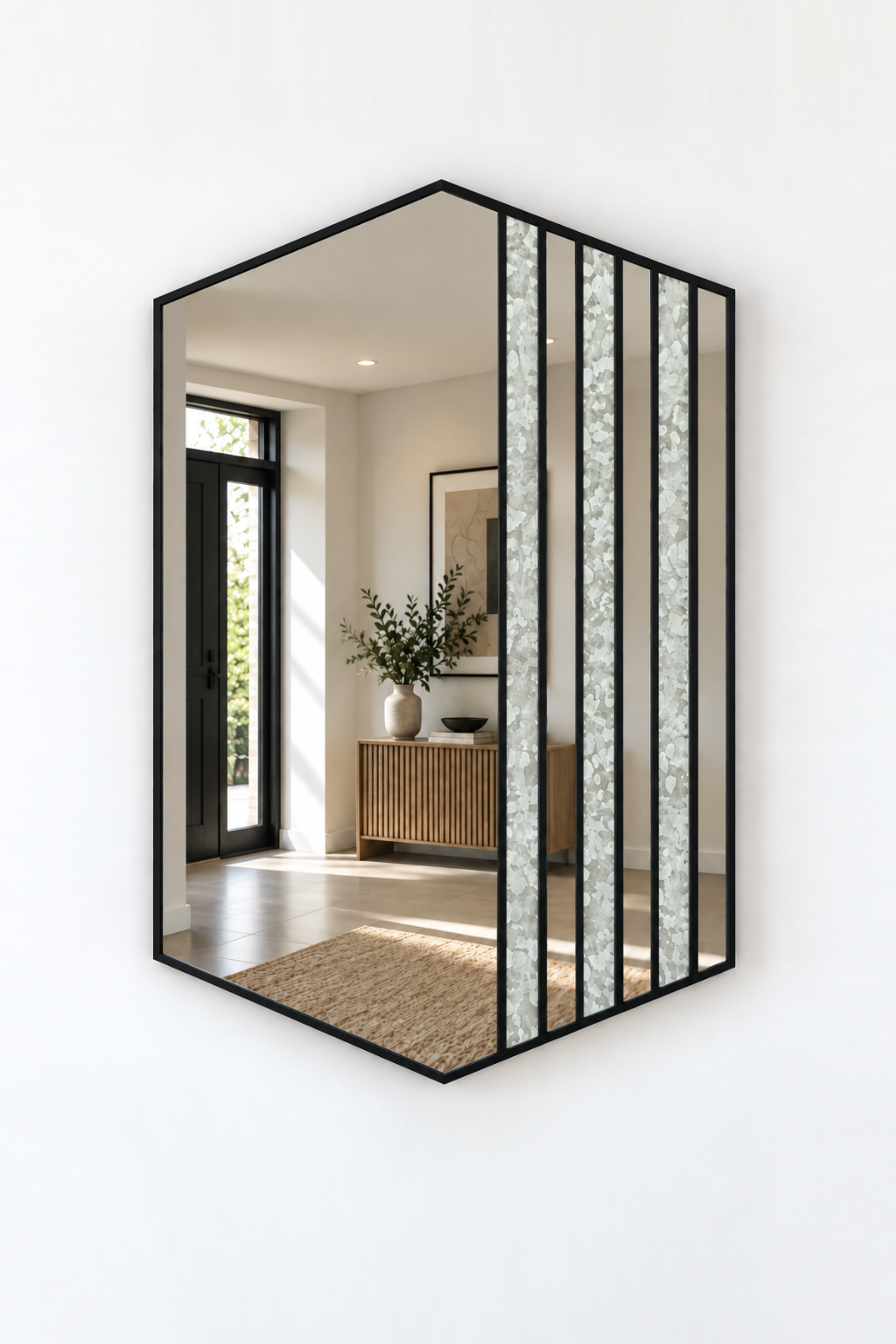 Hexagonal wall mirror with a black metal frame and vertical textured glass panels, mounted on a white wall.