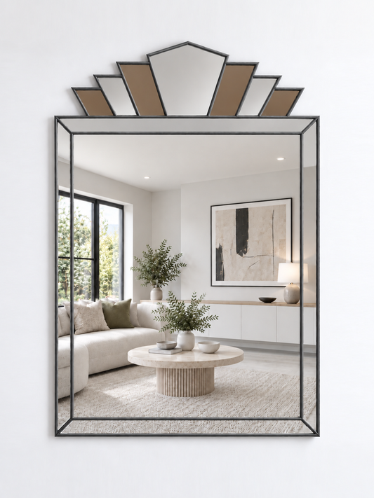 A large rectangular wall mirror with an antique metal frame and a decorative geometric fan-shaped top with bronze mirror accents