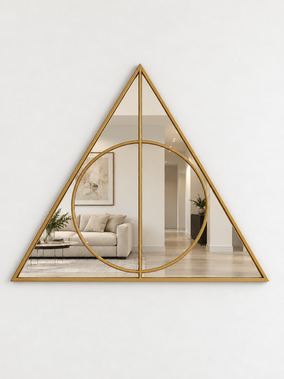 A triangular wall mirror with a brass metal border