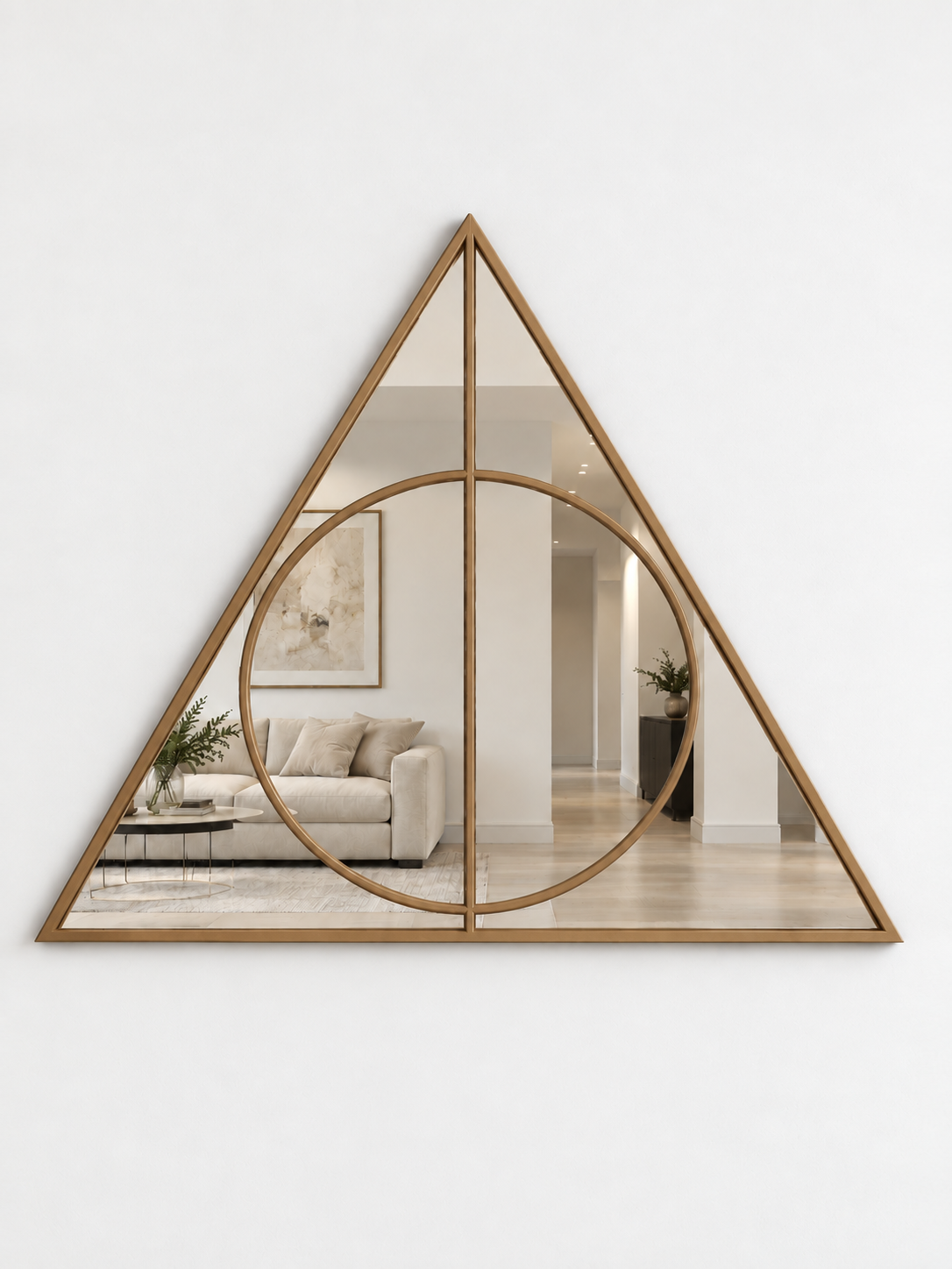 A triangular wall mirror with a gold metal border