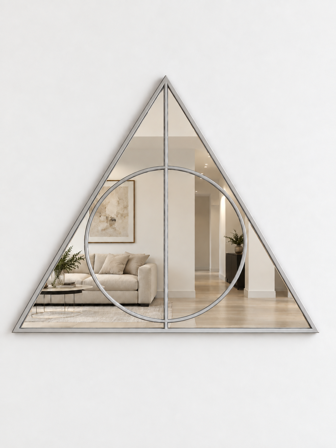 A triangular wall mirror with a silver metal border