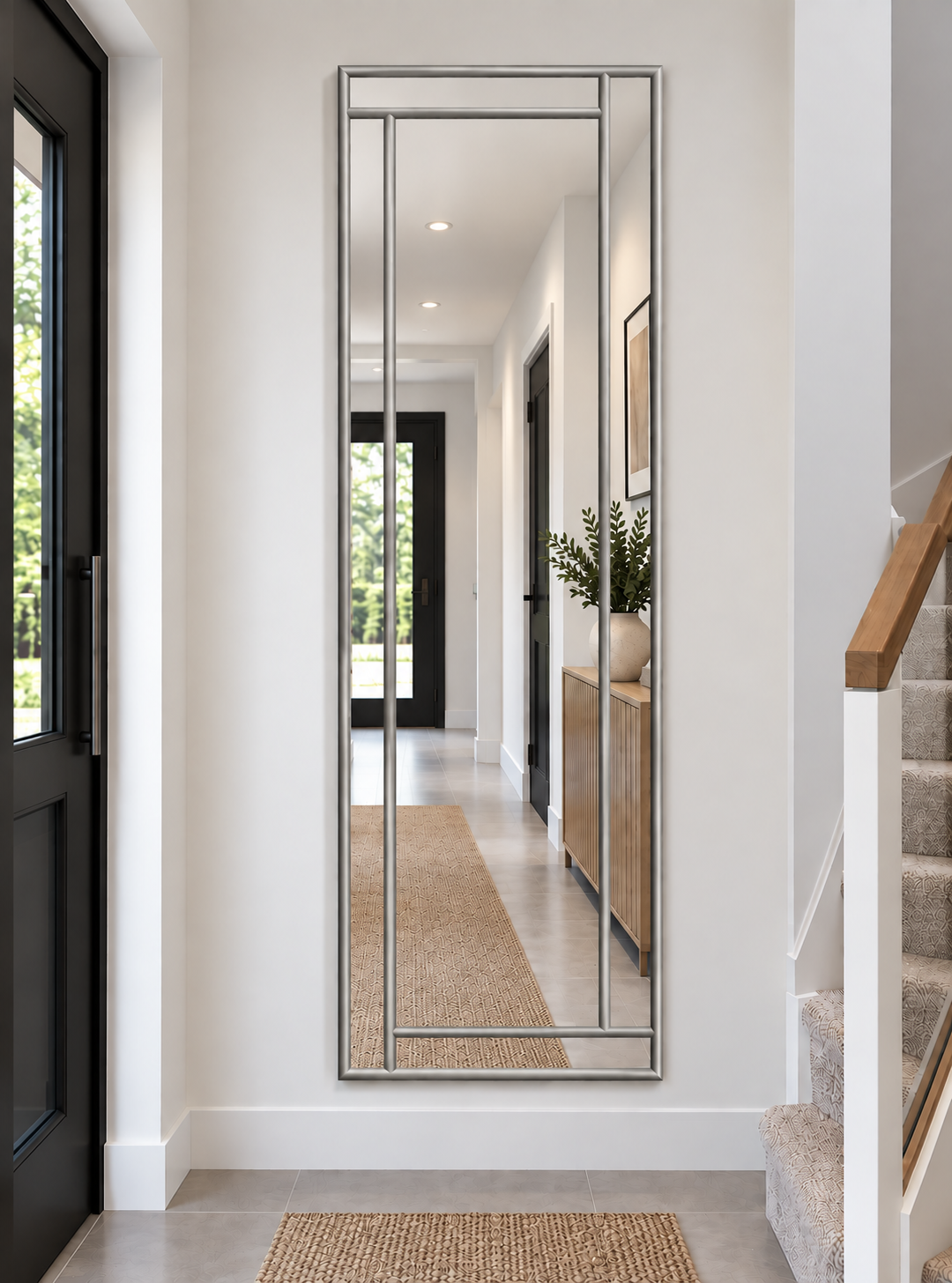 A full length contemporary mirror in silver