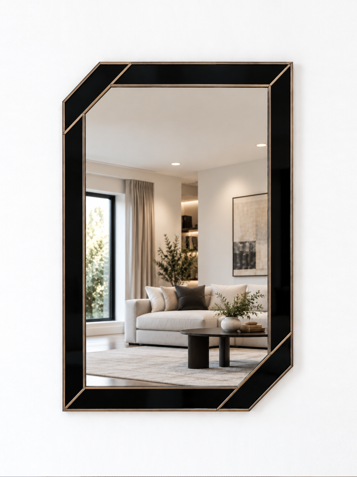 A contemporary wall mirror with black outer panels and a gold metal border