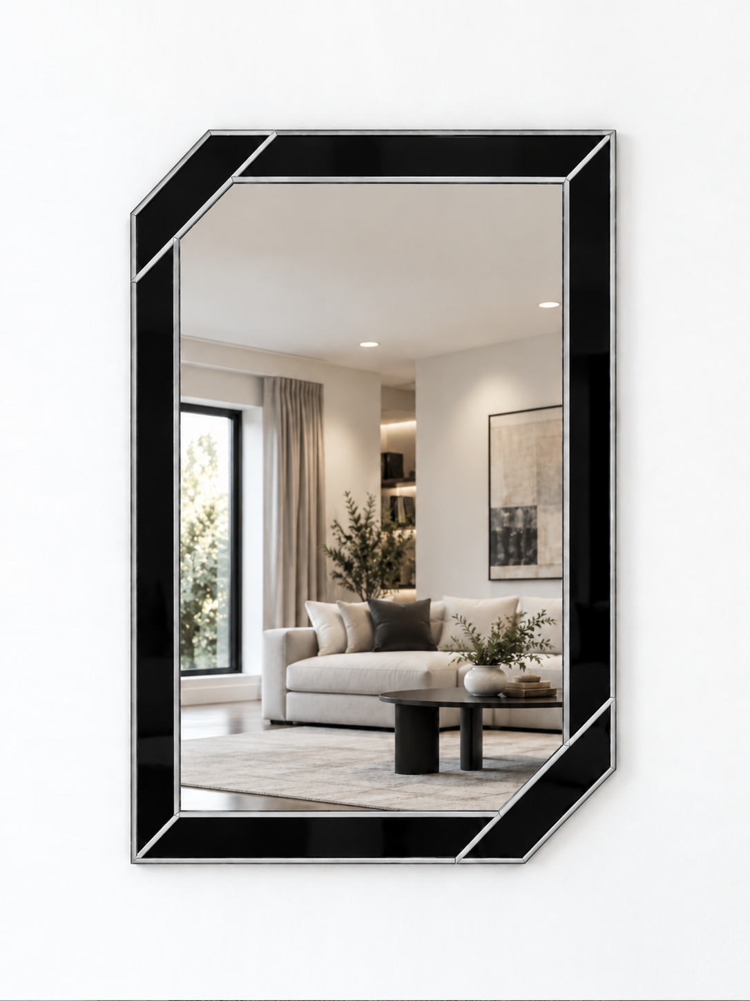 A contemporary wall mirror with black outer panels and a silver metal border