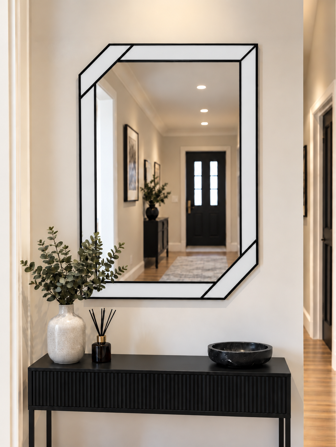 Art deco wall mirror featuring a white border style outer panels in black